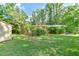 Well-maintained backyard features a charming wooden deck and a classic storage shed at 308 Rainbow Dr, Carrboro, NC 27510