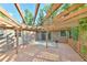Spacious patio with a pergola offering shade and outdoor enjoyment at 308 Rainbow Dr, Carrboro, NC 27510
