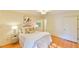 Bedroom featuring a bed, hardwood floors, and windows for natural light at 308 Rainbow Dr, Carrboro, NC 27510
