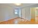 Clean, light filled bedroom with hardwood floors and a double door closet at 308 Rainbow Dr, Carrboro, NC 27510