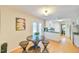 Charming breakfast nook offers table and chairs, adjacent to kitchen and backyard access at 308 Rainbow Dr, Carrboro, NC 27510
