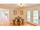 Bright breakfast nook features backyard access, natural light and access to kitchen at 308 Rainbow Dr, Carrboro, NC 27510