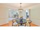Dining area with hardwood floors, modern light fixture, and seamless flow into the living spaces at 308 Rainbow Dr, Carrboro, NC 27510