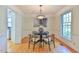 Charming dining room with hardwood floors, elegant lighting fixture, and stylish decor at 308 Rainbow Dr, Carrboro, NC 27510