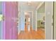 Open entryway with wood floors and inviting view into the home's living spaces at 308 Rainbow Dr, Carrboro, NC 27510