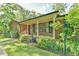 Charming brick home featuring a covered front porch with classic columns at 308 Rainbow Dr, Carrboro, NC 27510