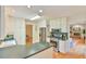 Spacious kitchen with white cabinets, modern appliances, and connection to living area at 308 Rainbow Dr, Carrboro, NC 27510