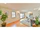 Spacious living room featuring wood floors, natural light, and a seamless connection to the outdoors at 308 Rainbow Dr, Carrboro, NC 27510