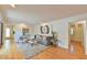 Bright living room boasts hardwood floors, neutral paint, and a comfortable seating area at 308 Rainbow Dr, Carrboro, NC 27510