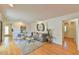 Well-lit living room featuring hardwood floors, neutral paint, and comfortable seating at 308 Rainbow Dr, Carrboro, NC 27510