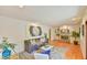 Inviting living room with a decorative rug, fireplace, and an artistic painting displayed at 308 Rainbow Dr, Carrboro, NC 27510