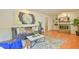 Comfortable living room with a decorative rug, fireplace, and eye-catching art at 308 Rainbow Dr, Carrboro, NC 27510