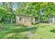 Backyard shows a storage shed with classic design, complemented by a stepping stone path at 308 Rainbow Dr, Carrboro, NC 27510