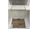Sample of design materials that includes white cabinets, light countertops, subway tile, and wood-look luxury vinyl flooring at 335 Chesapeake Cmns St # 107, Garner, NC 27529