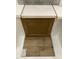 Sample of design materials that includes brown cabinets, light countertops, and wood-look luxury vinyl flooring at 335 Chesapeake Cmns St # 107, Garner, NC 27529