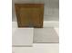 Sample of design materials that includes brown cabinets, white countertops, and dark tile at 335 Chesapeake Cmns St # 107, Garner, NC 27529