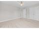 Neutral bedroom with carpeting and ceiling fan, featuring a closet and doorway access at 3409 Lemon Springs Rd, Sanford, NC 27332