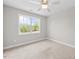 Bedroom featuring carpet, light paint and trim, a ceiling fan and a window providing exterior light at 3409 Lemon Springs Rd, Sanford, NC 27332