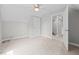 Neutral-toned bedroom with carpeted floor and open doorway into the hallway at 3409 Lemon Springs Rd, Sanford, NC 27332