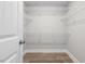 Walk-in closet with laminate flooring and wire shelving at 3409 Lemon Springs Rd, Sanford, NC 27332