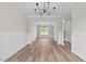 Spacious dining area boasts open floor plan and modern lighting fixtures at 3409 Lemon Springs Rd, Sanford, NC 27332