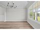 Dining room with large window and natural light; hardwood floor at 3409 Lemon Springs Rd, Sanford, NC 27332