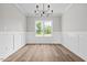Dining area features wainscoting, natural light, and chandelier at 3409 Lemon Springs Rd, Sanford, NC 27332