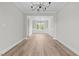 Bright dining room boasts new flooring, modern lighting, and wainscoting detail at 3409 Lemon Springs Rd, Sanford, NC 27332