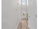 Bright entryway with a high ceiling, showcasing a modern door and stylish wood-look flooring at 3409 Lemon Springs Rd, Sanford, NC 27332
