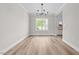 Open floor plan entrance with hardwood floors and decorative lighting fixture at 3409 Lemon Springs Rd, Sanford, NC 27332