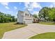 Charming home with a well-maintained lawn, attached garage, and inviting front porch at 3409 Lemon Springs Rd, Sanford, NC 27332