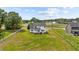 Charming two-story home with a white picket fence, offering a picturesque and inviting curb appeal at 3409 Lemon Springs Rd, Sanford, NC 27332