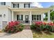 Inviting front porch with red roses, perfect for relaxing and enjoying the neighborhood ambiance at 3409 Lemon Springs Rd, Sanford, NC 27332