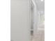 Upstairs hallway showcases neutral walls, plush carpeting, and multiple access doors at 3409 Lemon Springs Rd, Sanford, NC 27332