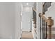 Hallway with wooden staircase and open door to bathroom at 3409 Lemon Springs Rd, Sanford, NC 27332