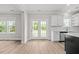 Bright kitchen with white cabinetry and quartz countertops plus stainless appliances at 3409 Lemon Springs Rd, Sanford, NC 27332