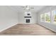 Spacious living room features a ceiling fan, and large windows providing ample natural light at 3409 Lemon Springs Rd, Sanford, NC 27332