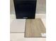 Interior design elements showcase navy cabinets, white countertops, and light wood flooring at 343 Chesapeake Cmns St # 109, Garner, NC 27529