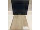 Interior design elements showcase navy cabinets and light wood flooring at 343 Chesapeake Cmns St # 109, Garner, NC 27529