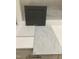 Design studio close-up showing a grey kitchen cabinet door and light colored stone countertop at 347 Chesapeake Cmns St # 110, Garner, NC 27529