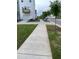 Street view in the community with sidewalks and townhome architecture at 3604 Soaring Elm Dr, Durham, NC 27703