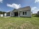 Back exterior of home featuring a covered porch and spacious backyard at 38 Gander Dr, Benson, NC 27504