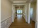 Hallway with elegant trim and wood floors lead to other areas of the home at 38 Gander Dr, Benson, NC 27504