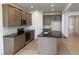 Kitchen with stainless appliances, gray marbled backsplash and a large island at 38 Gander Dr, Benson, NC 27504