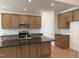 Kitchen features granite counters, stainless appliances and wooden cabinets at 38 Gander Dr, Benson, NC 27504