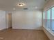 Bright living room with wood floors and a window for natural light at 38 Gander Dr, Benson, NC 27504