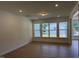 Living room with wood floors and lots of windows for natural light at 38 Gander Dr, Benson, NC 27504