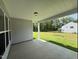 View of the covered patio with views of the well-manicured backyard at 38 Gander Dr, Benson, NC 27504