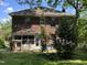 The back of a brick home with its screened-in back porch and exterior details at 404 Kinsey St, Raleigh, NC 27603