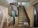 A view of an interior staircase, showing the steps and the surrounding architectural details at 404 Kinsey St, Raleigh, NC 27603